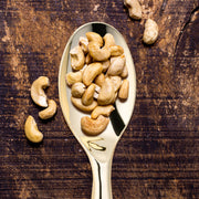 Disposable gold plastic serving spoons, 9.75 inches, ideal for stress-free hosting and catering, case of 60.