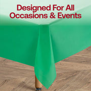Disposable hunter green plastic tablecloth in a rectangular 54 x 108 size, ideal for easy cleanup after events and parties.