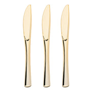 Disposable metallic gold plastic knives, offering convenience and sophistication for large gatherings and events