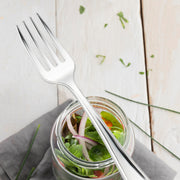 Durable 4-inch silver mini plastic tasting fork, lightweight and stylish for elegant food presentation