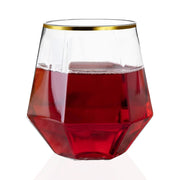 Durable and chic 12 oz clear hexagonal plastic wine goblets with gold accents, great for serving red or white wine