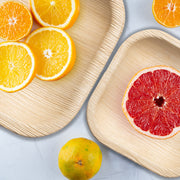 Eco-friendly 4" square pastry plates featured at a green-themed event with natural decor and sweet treats