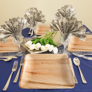 Eco dinnerware placed neatly at each setting for a cozy, plant-based dinner party or outdoor reception.