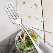 Elegant 4-inch clear plastic appetizer forks, disposable and stylish for catering, banquets, and special occasions