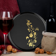 Elegant black dinner plate with gold floral rim shown with beef entrée at formal reception