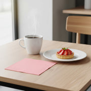 Elegant, disposable pink paper cocktail napkins in a bulk 600-pack, each measuring 10 inches square when unfolded.