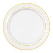 Elegant gold-rimmed clear dinner plates set for holiday parties or corporate galas