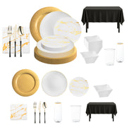 Elegant gold charger plates with matching white and gold dinnerware, perfect for upscale wedding receptions.