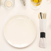 Elegant gold plastic cutlery set in white napkin rolls, perfect for fine dining and formal events, case for 100 guests.