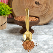 Elegant gold plastic serving spoons, 9.75 inches, adding a sophisticated touch to any event, sold in a pack of 60.