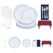 Elegant mermaid-themed disposable dinnerware set featuring turquoise and silver mosaic-rim plates, silver cutlery, burgundy tablecloths, and navy napkins.