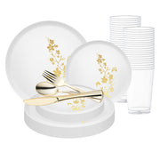 Elegant white and gold floral plastic plate set styled with matching cutlery and tumbler for a wedding dinner