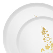 Elegant white dinner and salad plates with gold floral rim styled for upscale wedding reception