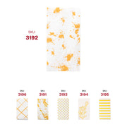 Elegant white paper dinner napkins featuring a chic gold paint splatter design, perfect for stylish table settings
