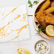 Fancy white napkins featuring gold paint splatter—perfect for entertaining in style