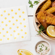Festive gold dot cocktail napkins on crisp white paper, designed for versatile use at both casual and formal events