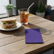 Folded purple paper napkin with crisp edges and clean look, 16 x 16 inches when unfolded, from 600-piece set