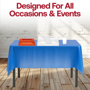 Football fans celebrate with themed meals on a stylish blue and orange setup.
