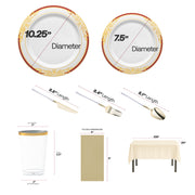 Gold-handle Moderno cutlery and elegant rimmed plates from the Grateful Hearts Package displayed on table.