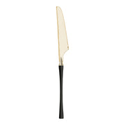 Gold Moderno disposable plastic dinner knives featuring stylish black handles.