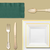Gold flatware paired with matching rimmed plates for a sophisticated dining experience.