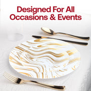 Gold wave rimmed plastic plates with gold rim paired with gold cutlery for glam wedding setting