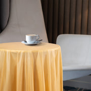 Guests enjoyed golden-accented decor with 84" disposable plastic coverings.