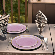 Guests enjoyed light fare on 7.5" pink plates with gold accents during an upscale garden brunch.