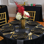 Guests enjoyed starters on 7.5" black plates with gold accents during a modern reception.