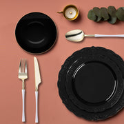 Guests enjoying bold black vintage tableware at a black-tie event or formal party.