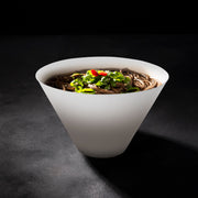 Guests shared family-style dishes from round deep serving bowls.