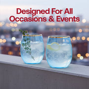 Hand holding a 12 oz blue tinted plastic tumbler with gold trim filled with red wine, sophisticated disposable glassware for parties.