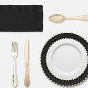 Holiday dinner spread featuring the Dear Santa Set‚Äôs gold cutlery and bold color palette.