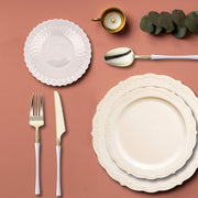 Ivory Vintage Disposable Plastic Tableware Set arranged for an elegant dinner with soft lighting and floral accents.