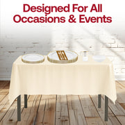 Ivory tablecloths and gold accented dishes create a refined mood with the Jingle Bells Set.