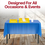 Kids and adults gathered around a table set with Blue, Yellow & White party set