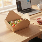 Kraft folded paper #2 containers filled and stacked at a takeout counter, eco-friendly disposable packaging for delis, cafes, and food trucks.
