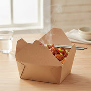 Kraft folded paper #4 containers filled and stacked at a takeout counter, eco-friendly disposable packaging for delis, cafes, and food trucks.

