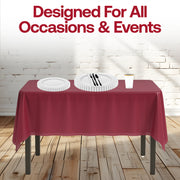 Laid-back fans enjoy stylish meals with white pearl plates and burgundy napkins in a backyard setup.
