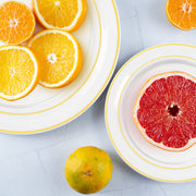 Luxurious clear with gold edge plastic plates for appetizers, stacked and ready for events