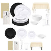 Minimalist white dinnerware with sleek black charger plates for a timeless look.