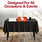 Outdoor tailgate with orange and black partyware set ready for guests’ arrival.