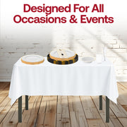 Outdoor wedding table set with The Golden Hour Package, ivory linens, and white with gold marble napkins in the sunset glow