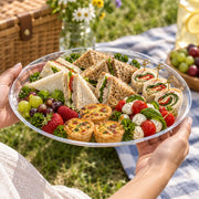 Oversized 18" Black Round Plastic Trays are ideal for self-serve snack stations, keeping food accessible while maintaining a polished looks.