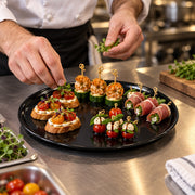 Perfect for buffets and grazing tables, these black plastic trays keep food organized while adding a modern, upscale touch.
