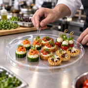 Perfect for wedding dessert tables, these 18" Black Round Plastic Trays keep cupcakes, and cookies, organized in style