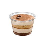Premium 1.5 oz clear plastic souffle cups shown stacked, space-saving disposable portion cups for prep stations and food service lines.
