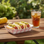 Premium 6 oz red checkered disposable paper tray featuring a hot dog and fries, retro-style food boat for professional party catering.