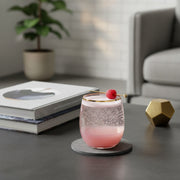 Premium blush pink plastic tumbler with gold rim featuring a refreshing dark berry cocktail, perfect for fancy party beverage service.