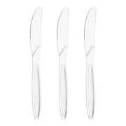 Premium clear medium heavy weight plastic knives shown fanned out, showing the tapered handle and crystal-clear finish of this disposable flatware.
